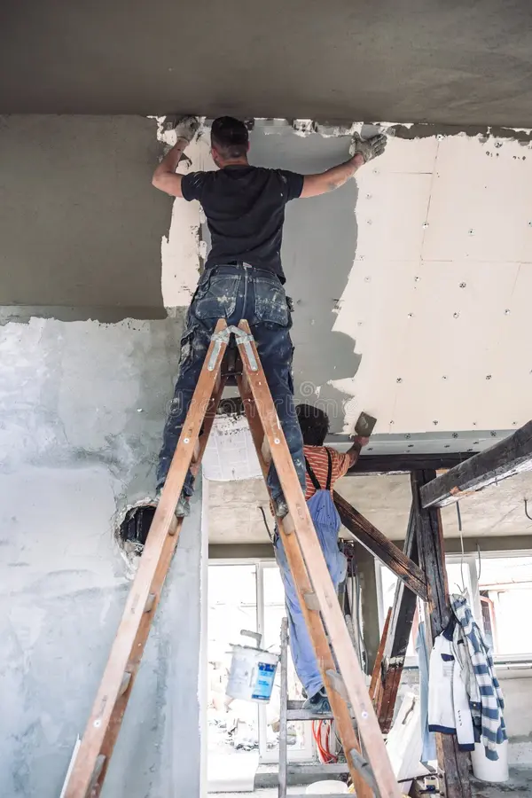 male-builder-work-overalls-plastering-restoring-old-wall-using-construction-trowel-male-builder-work-overalls-373863046 img-10